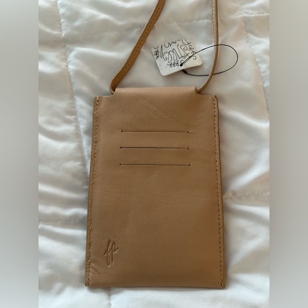 NWT Free People cross body purse can hold phone and credit cards.